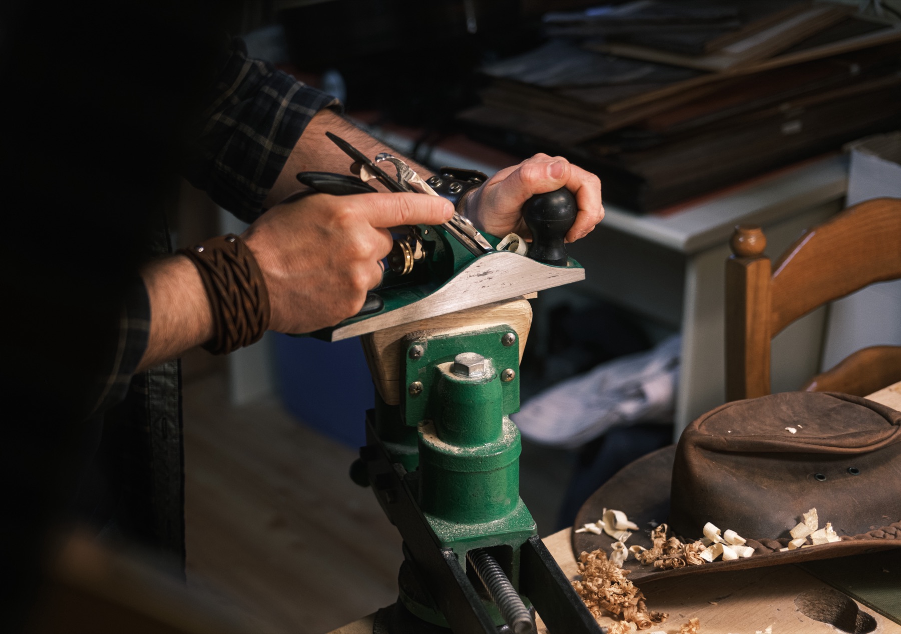 Luthier at the workbench in the Geisha Guitars workshop in Aviano, Italy