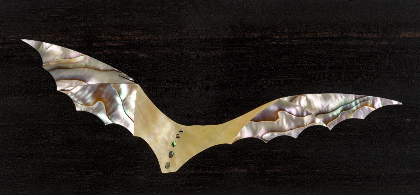 Mother-of-pearl bat inlay