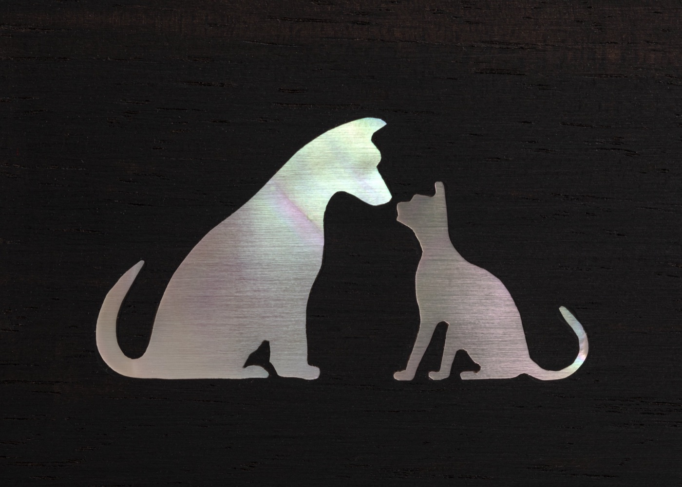 Mother-of-pearl inlay of a dog and a cat