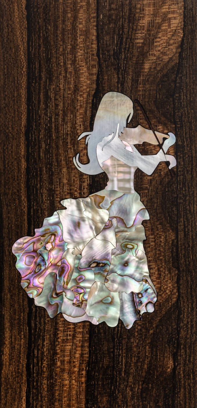 Mother-of-pearl inlay of a violinist